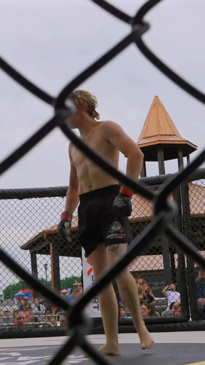 Nathan Johnson turning to the camera in the cage after his submission win